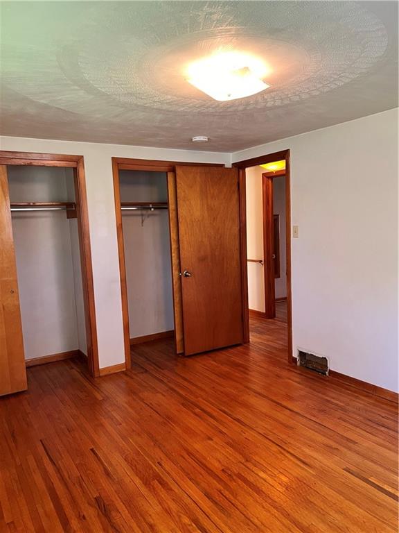 880 Pizza Barn Road Blairsville, PA 15717 - Photo 21 of 44 an empty room with wooden floor and closet