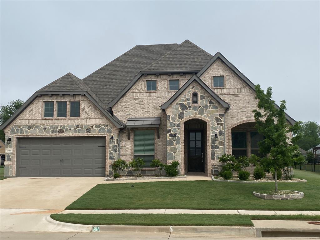 View of front of home featuring a front lawn