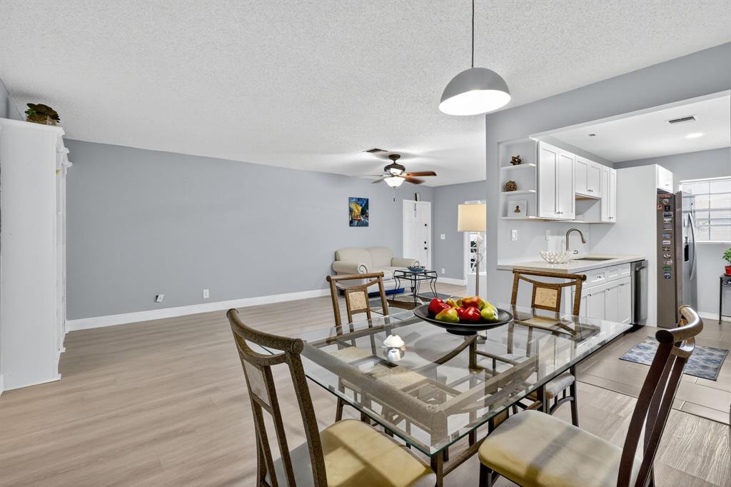 13930 Nesting Way, Unit C Delray Beach, FL 33484 - Photo 13 of 41 a dining room with furniture and wooden floor