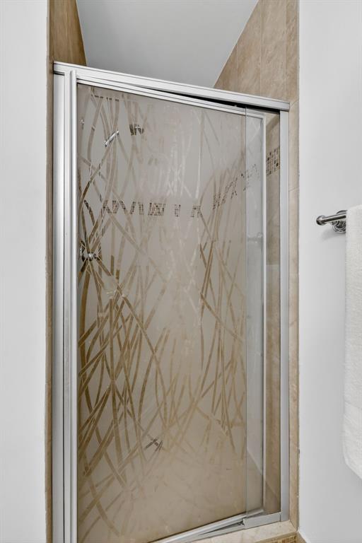 13930 Nesting Way, Unit C Delray Beach, FL 33484 - Photo 21 of 41 a bathroom with a shower curtain and a window