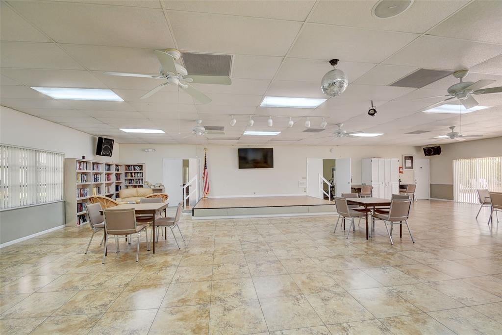 13930 Nesting Way, Unit C Delray Beach, FL 33484 - Photo 33 of 41 a living room with furniture and a large window