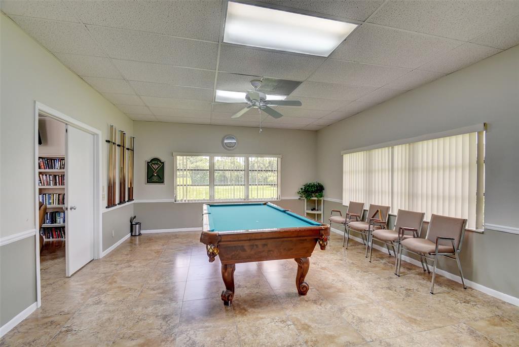 13930 Nesting Way, Unit C Delray Beach, FL 33484 - Photo 35 of 41 a room with furniture pool table and flat screen tv