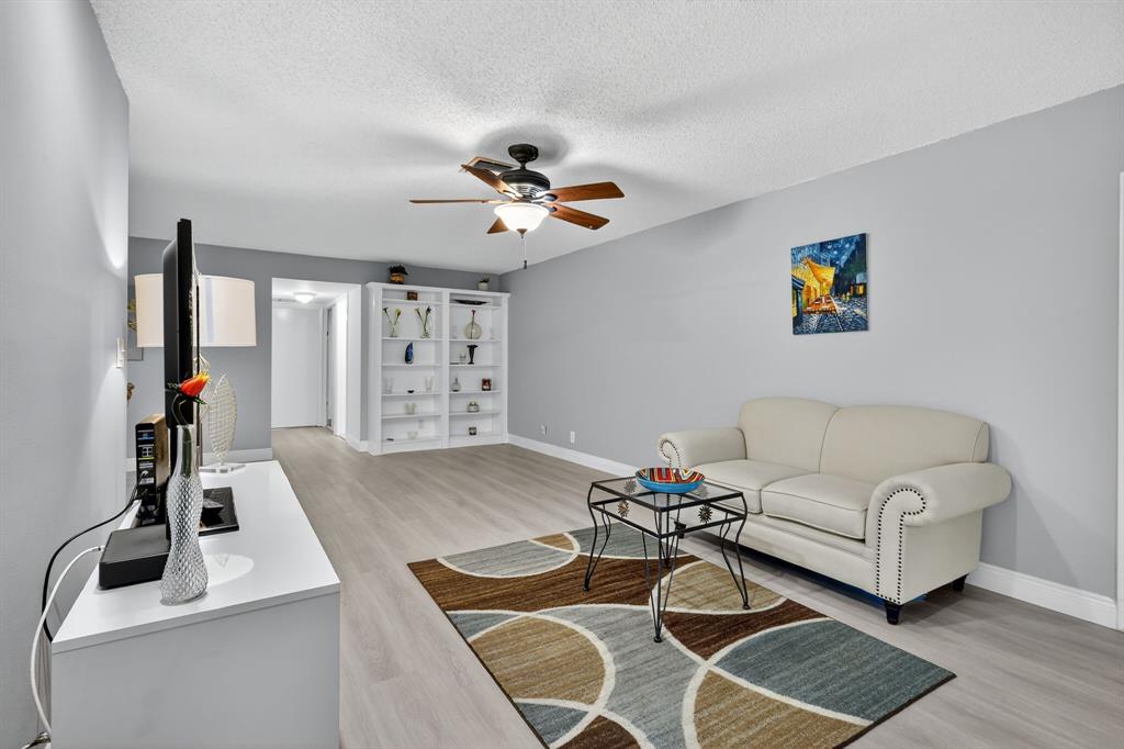 13930 Nesting Way, Unit C Delray Beach, FL 33484 - Photo 5 of 41 a living room with furniture and a flat screen tv