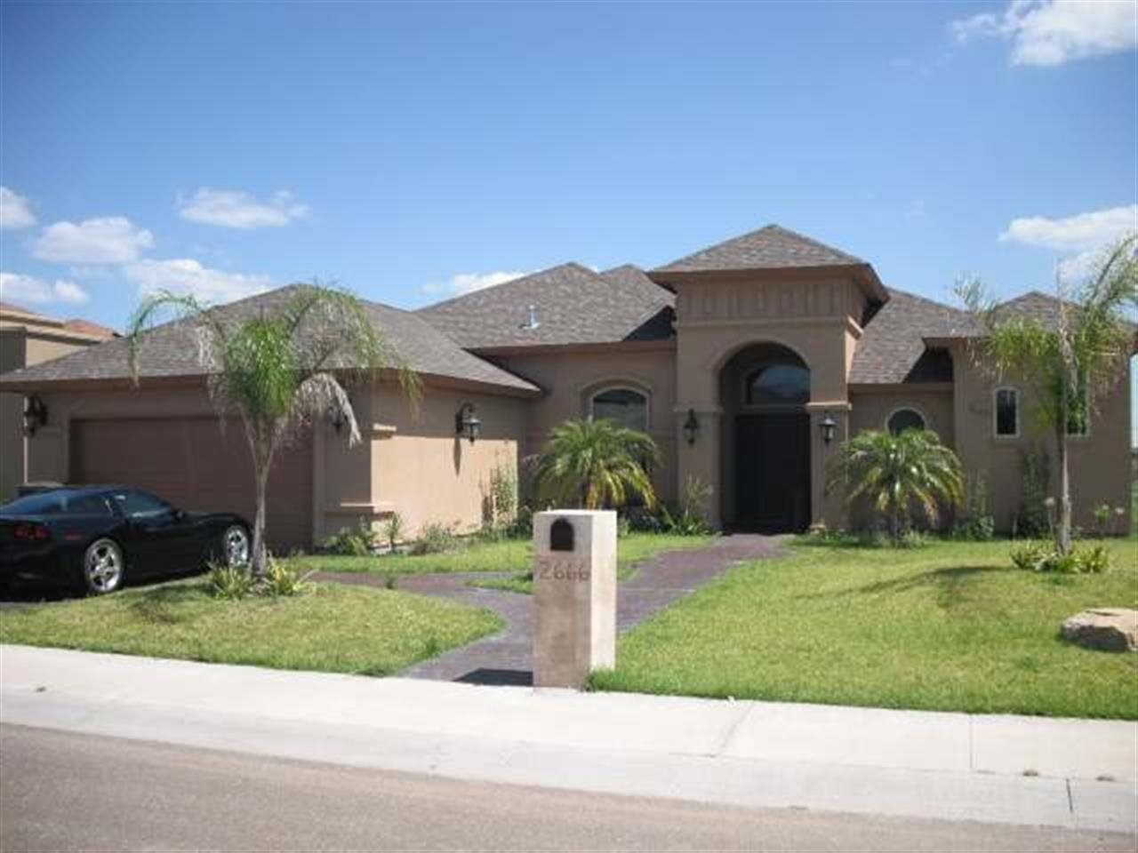 2666 Vineyard Loop Laredo, TX 78045 - Photo 1 of 1 a front view of a house with a yard