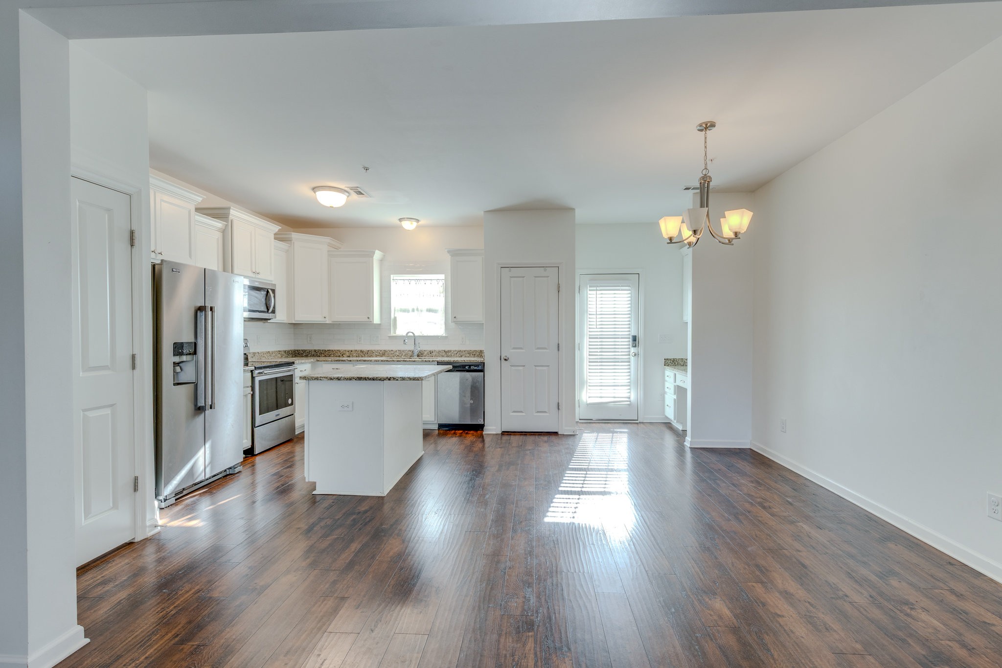 304 Oldbury Lane Spring Hill, TN 37174 - Photo 12 of 41 a view of kitchen with refrigerator and wooden floor