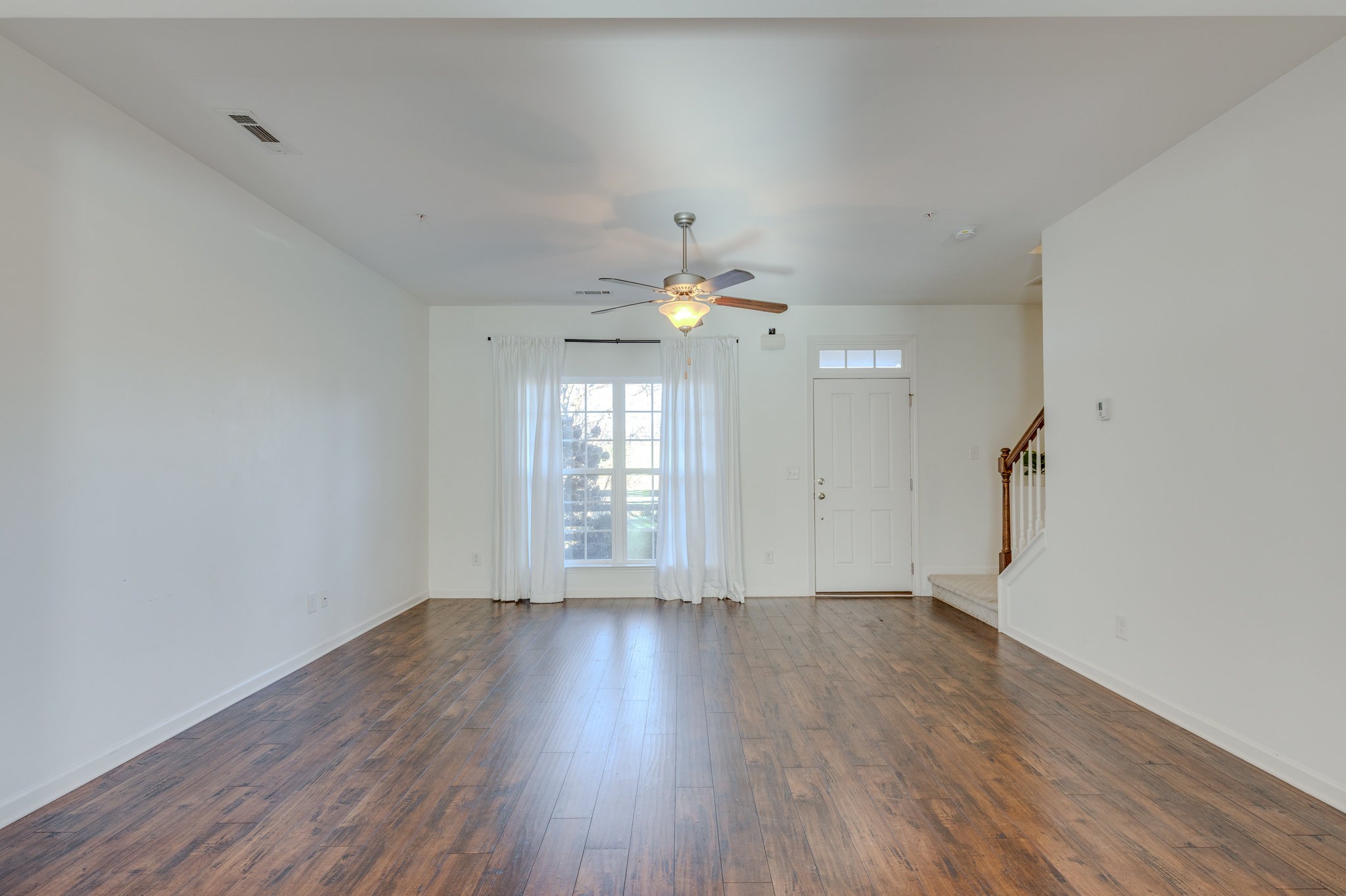 304 Oldbury Lane Spring Hill, TN 37174 - Photo 9 of 41 wooden floor in an empty room with a window