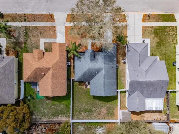 an aerial view of residential houses with outdoor space