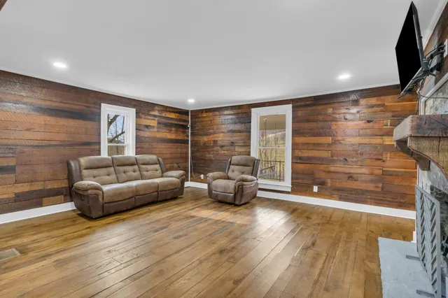 a view of a dining room with furniture and wooden floor
