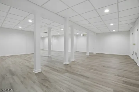 an empty room with wooden floor