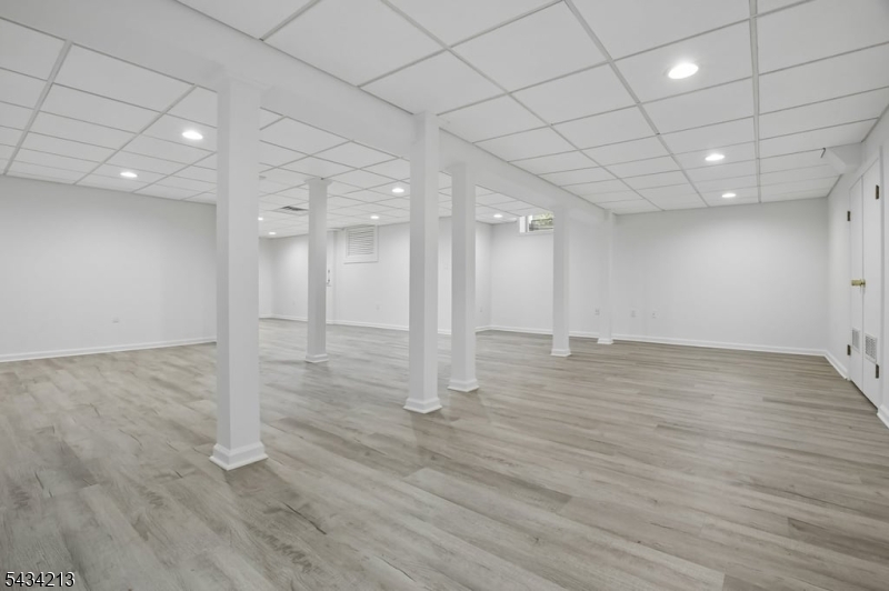 210 Mendham Road Bernardsville, NJ 07924 - Photo 38 of 45 an empty room with wooden floor