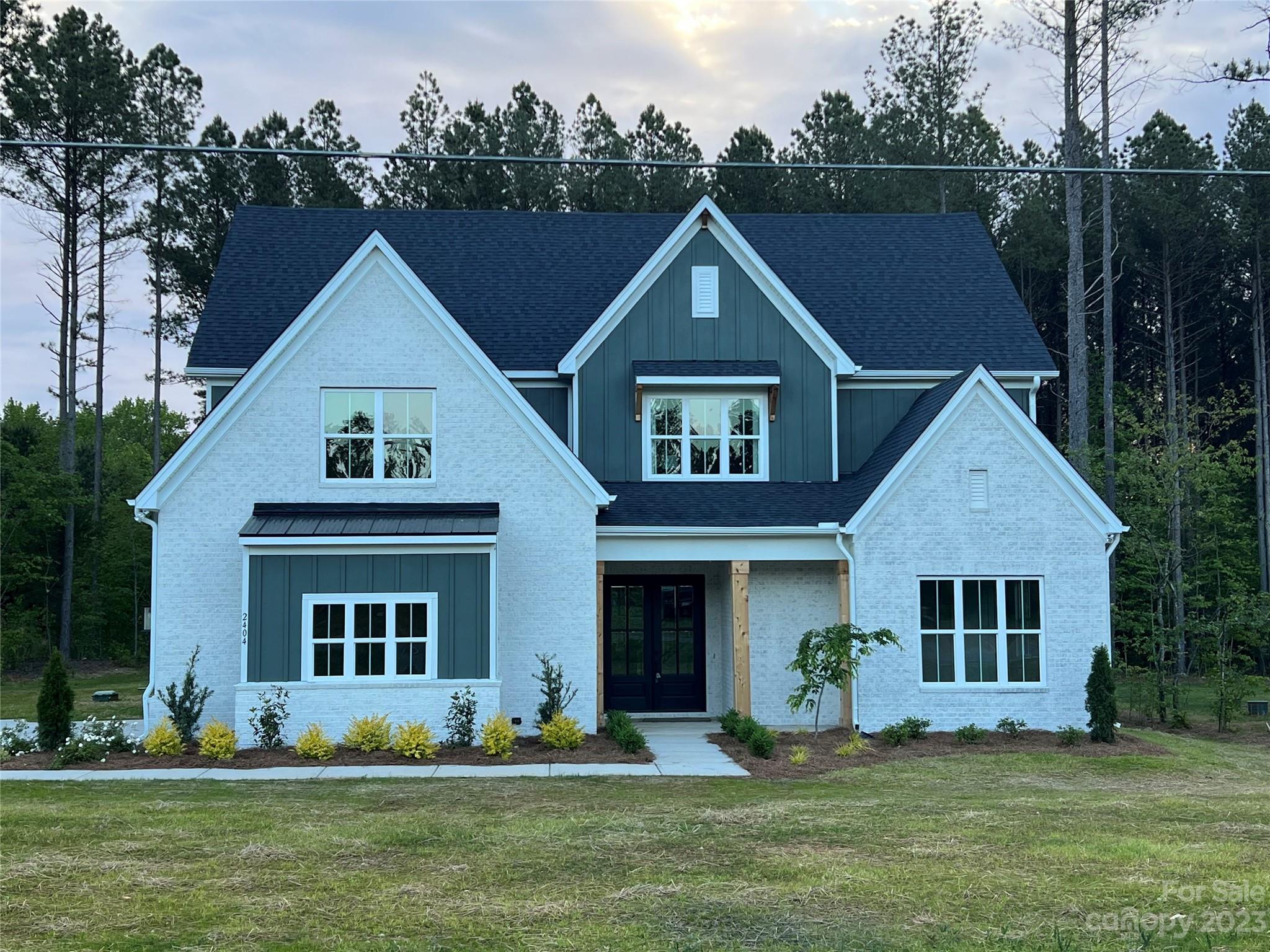 2404 Lee Lawing Road Lincolnton, NC 28092 - Photo 1 of 25 a front view of a house with a yard