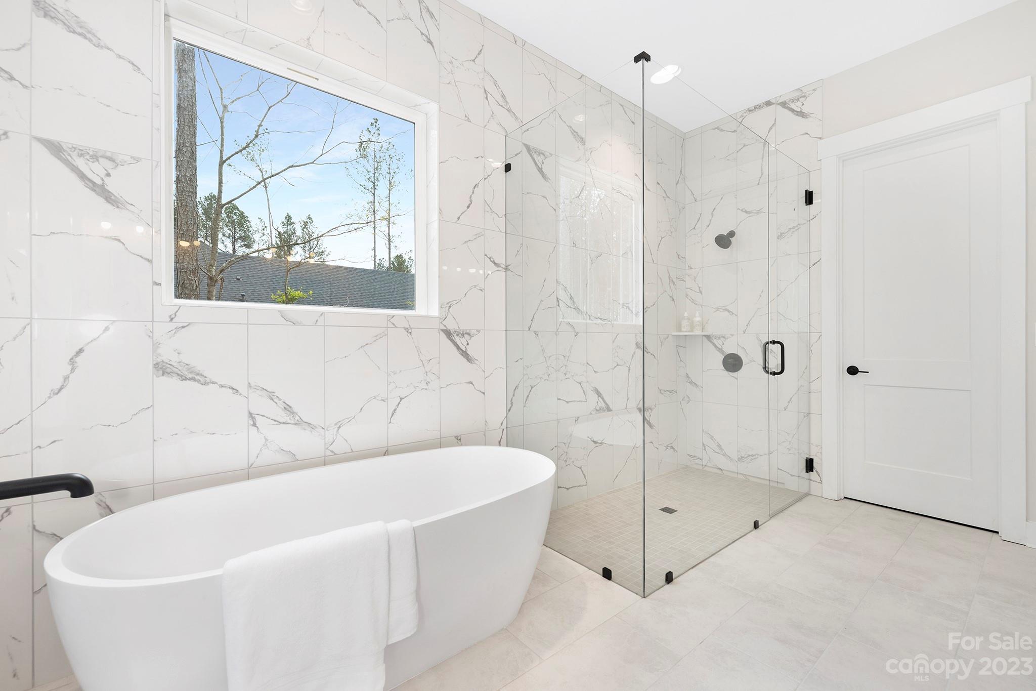 2404 Lee Lawing Road Lincolnton, NC 28092 - Photo 15 of 25 a white bath tub sitting next to a shower