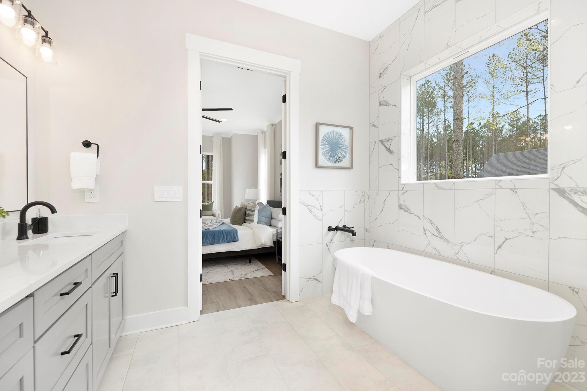 2404 Lee Lawing Road Lincolnton, NC 28092 - Photo 17 of 25 a en suite spacious bathroom with a tub sink and shower