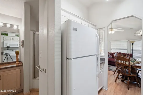 a white refrigerator freezer sitting inside of a kitchen