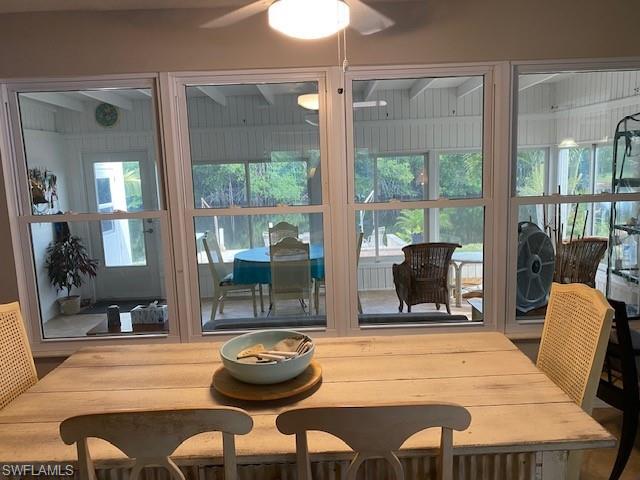 172 Riverwood Road Naples, FL 34114 - Photo 17 of 49 a room with furniture and a floor to ceiling window
