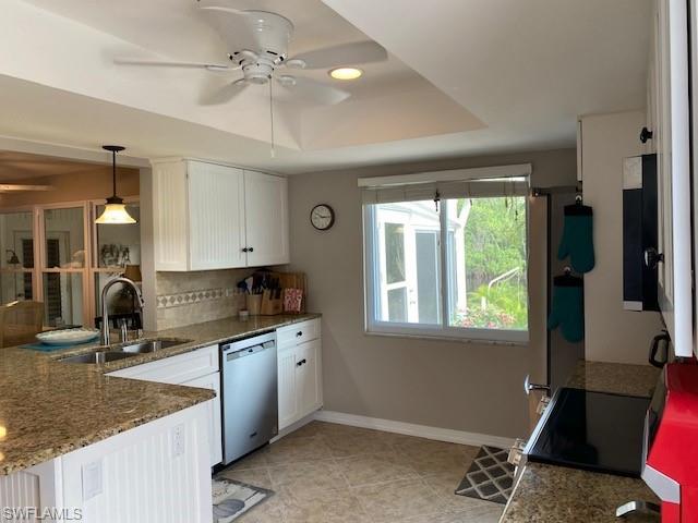 172 Riverwood Road Naples, FL 34114 - Photo 24 of 49 a kitchen that has a sink and a stove in it