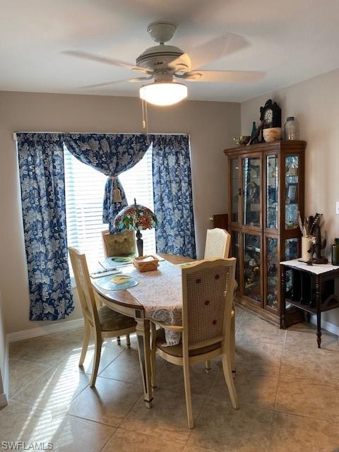 172 Riverwood Road Naples, FL 34114 - Photo 25 of 49 a view of a dining room with furniture and window