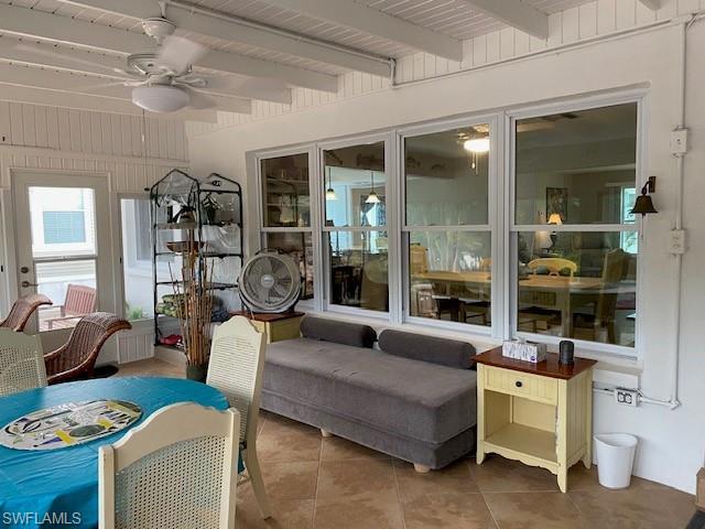 172 Riverwood Road Naples, FL 34114 - Photo 35 of 49 a living room with furniture and white walls