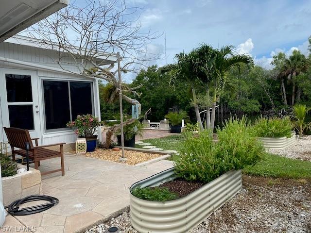 172 Riverwood Road Naples, FL 34114 - Photo 45 of 49 a view of outdoor space yard and patio