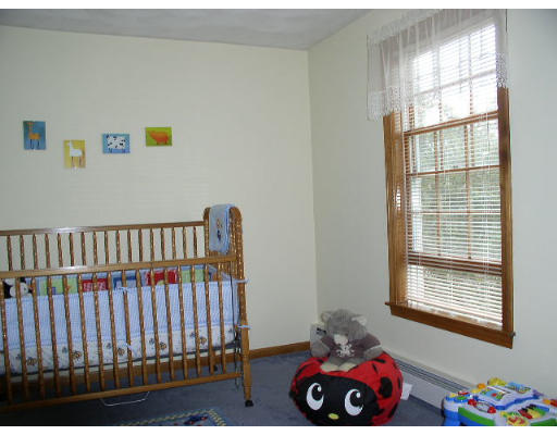 152 Flagg Hill Road Boxborough, MA 01719 - Photo 11 of 11 a bedroom with a bed and a window