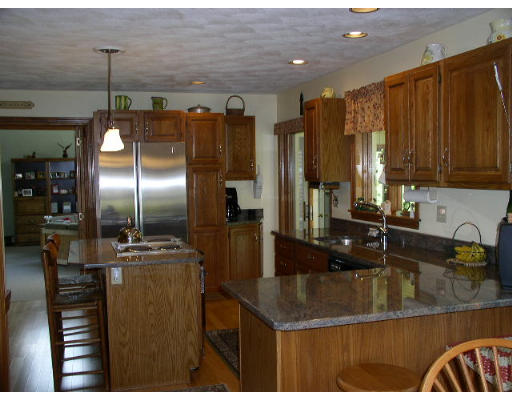 152 Flagg Hill Road Boxborough, MA 01719 - Photo 3 of 11 a kitchen with stainless steel appliances granite countertop a sink a counter space and stainless steel appliances