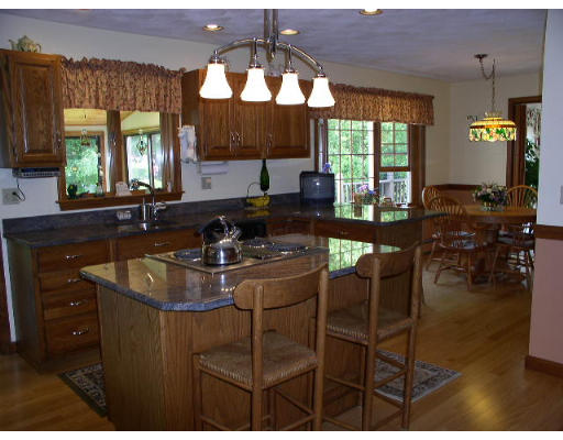152 Flagg Hill Road Boxborough, MA 01719 - Photo 4 of 11 a kitchen with sink and view of living room