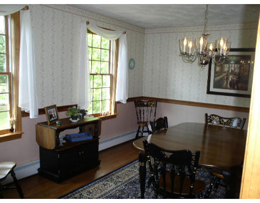 152 Flagg Hill Road Boxborough, MA 01719 - Photo 7 of 11 a dining room with furniture and chandelier