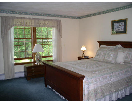152 Flagg Hill Road Boxborough, MA 01719 - Photo 9 of 11 a bedroom with a bed and a window