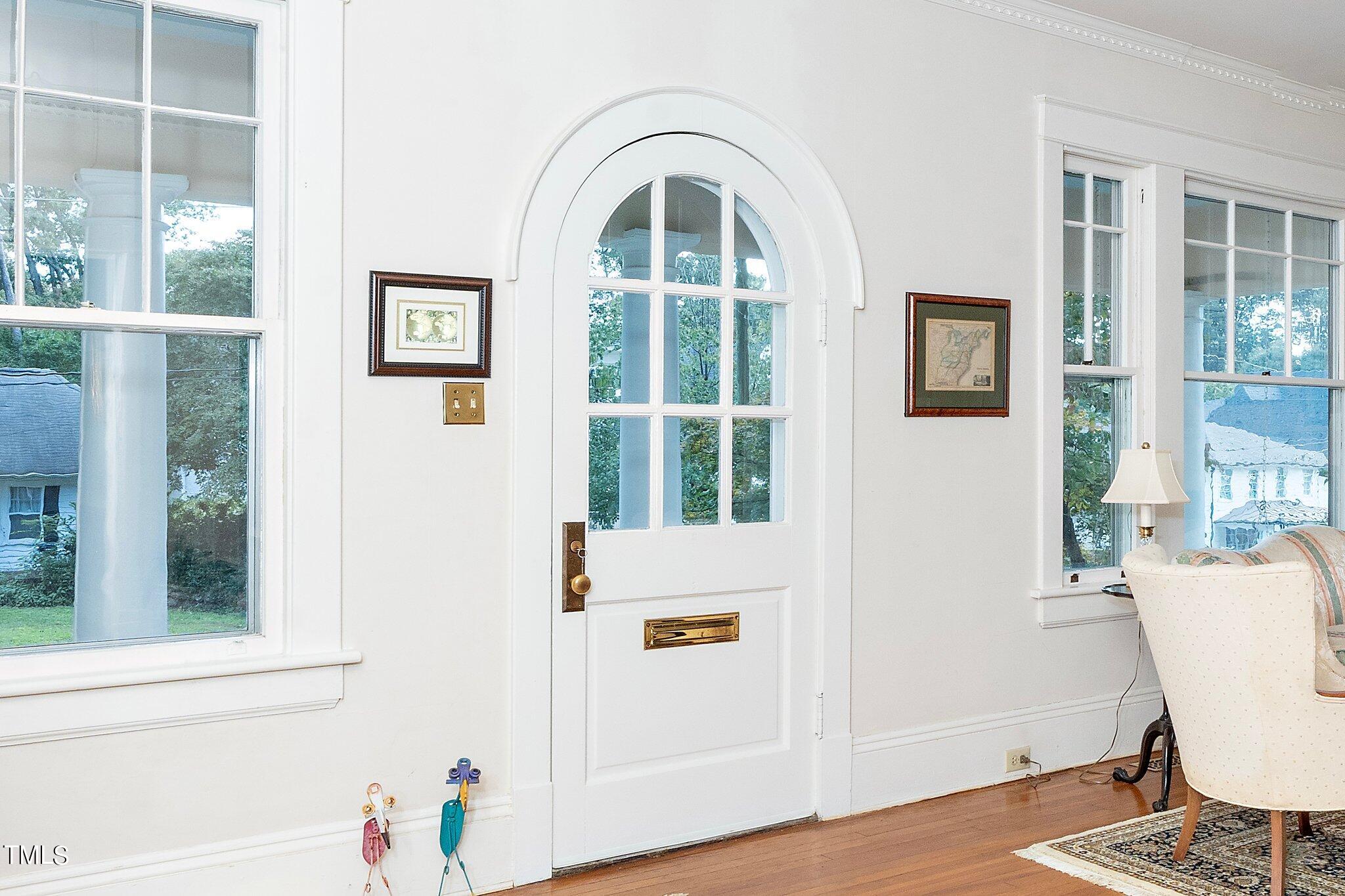2121 Cowper Drive Raleigh, NC 27608 - Photo 5 of 38 Entrance with Custom Door