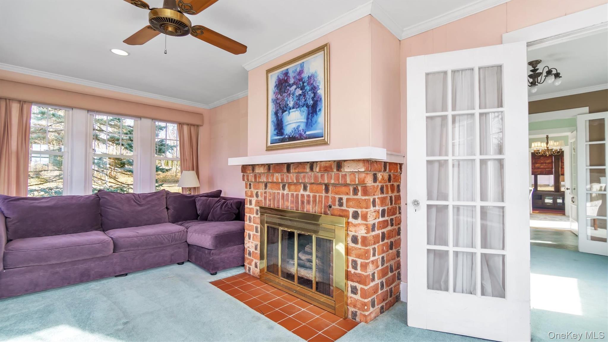 280 Wickham Avenue Mattituck, NY 11952 - Photo 14 of 41 a living room with furniture a flat screen tv and a fireplace