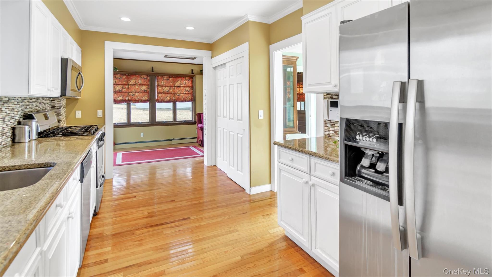 280 Wickham Avenue Mattituck, NY 11952 - Photo 22 of 41 a kitchen with stainless steel appliances granite countertop a refrigerator and a sink
