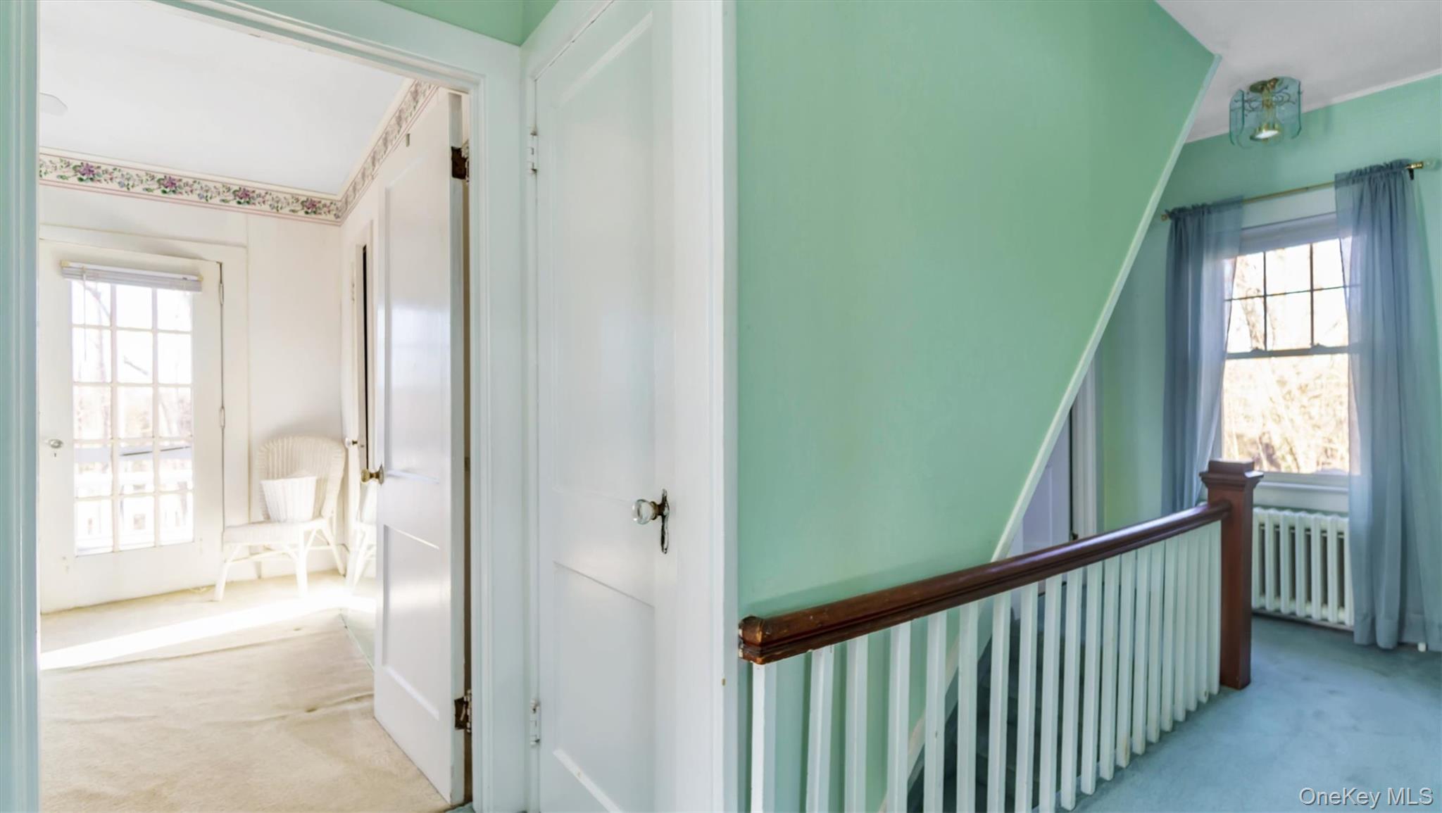 280 Wickham Avenue Mattituck, NY 11952 - Photo 26 of 41 a view of a hallway with wooden floor and windows