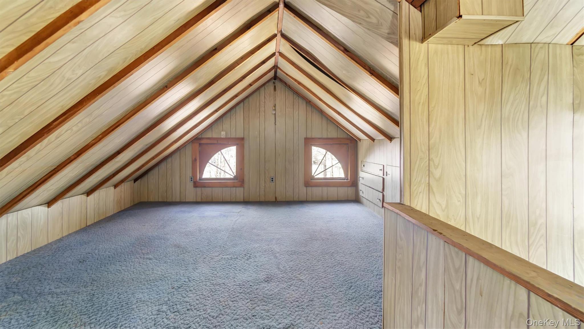 280 Wickham Avenue Mattituck, NY 11952 - Photo 32 of 41 a view of a hallway with window and stairs