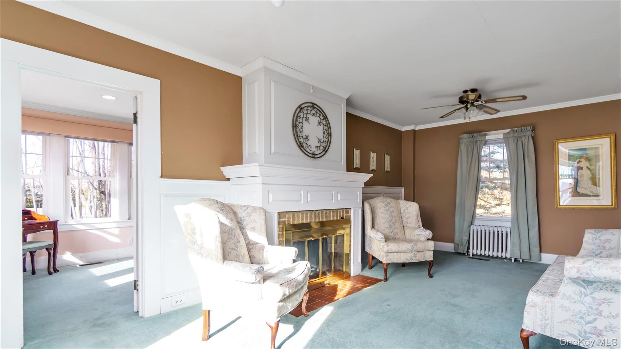 280 Wickham Avenue Mattituck, NY 11952 - Photo 10 of 41 a living room with furniture and a fireplace