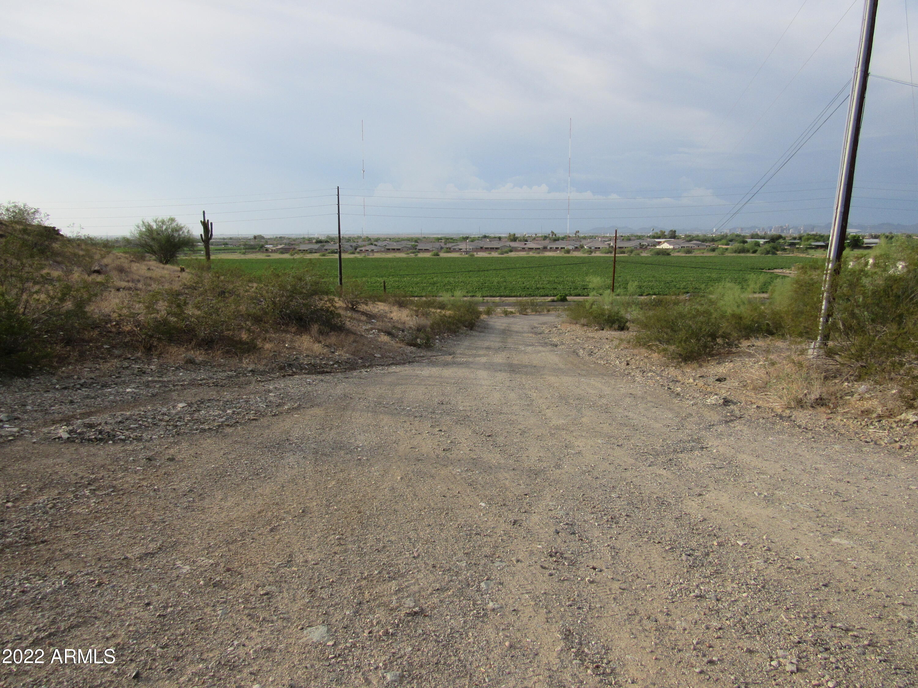2211 West Dobbins Road, Unit A Phoenix, AZ 85041 - Photo 15 of 33 a view of a field with wooden fence