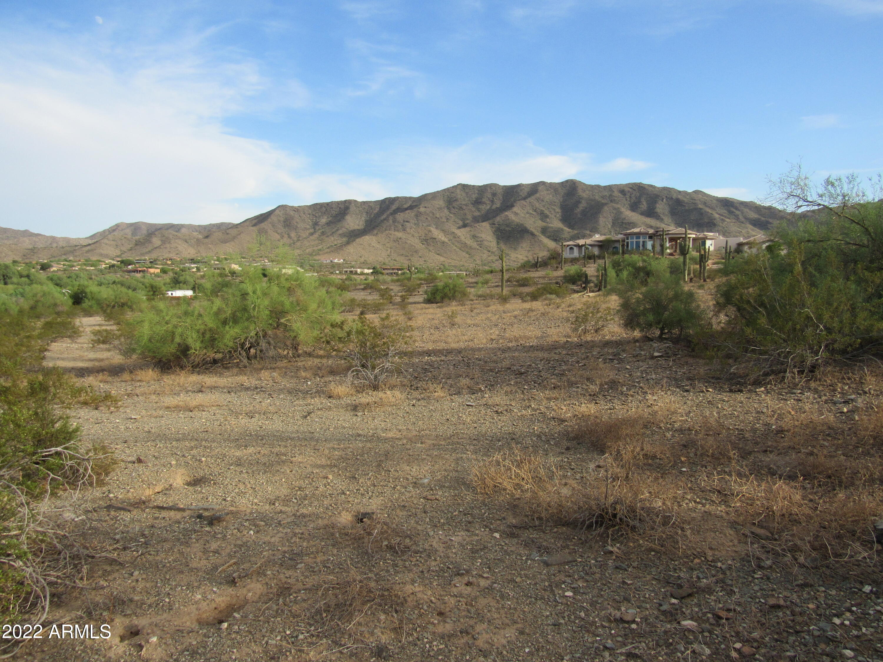 2211 West Dobbins Road, Unit A Phoenix, AZ 85041 - Photo 17 of 33 a view of a mountain in the distance in a field