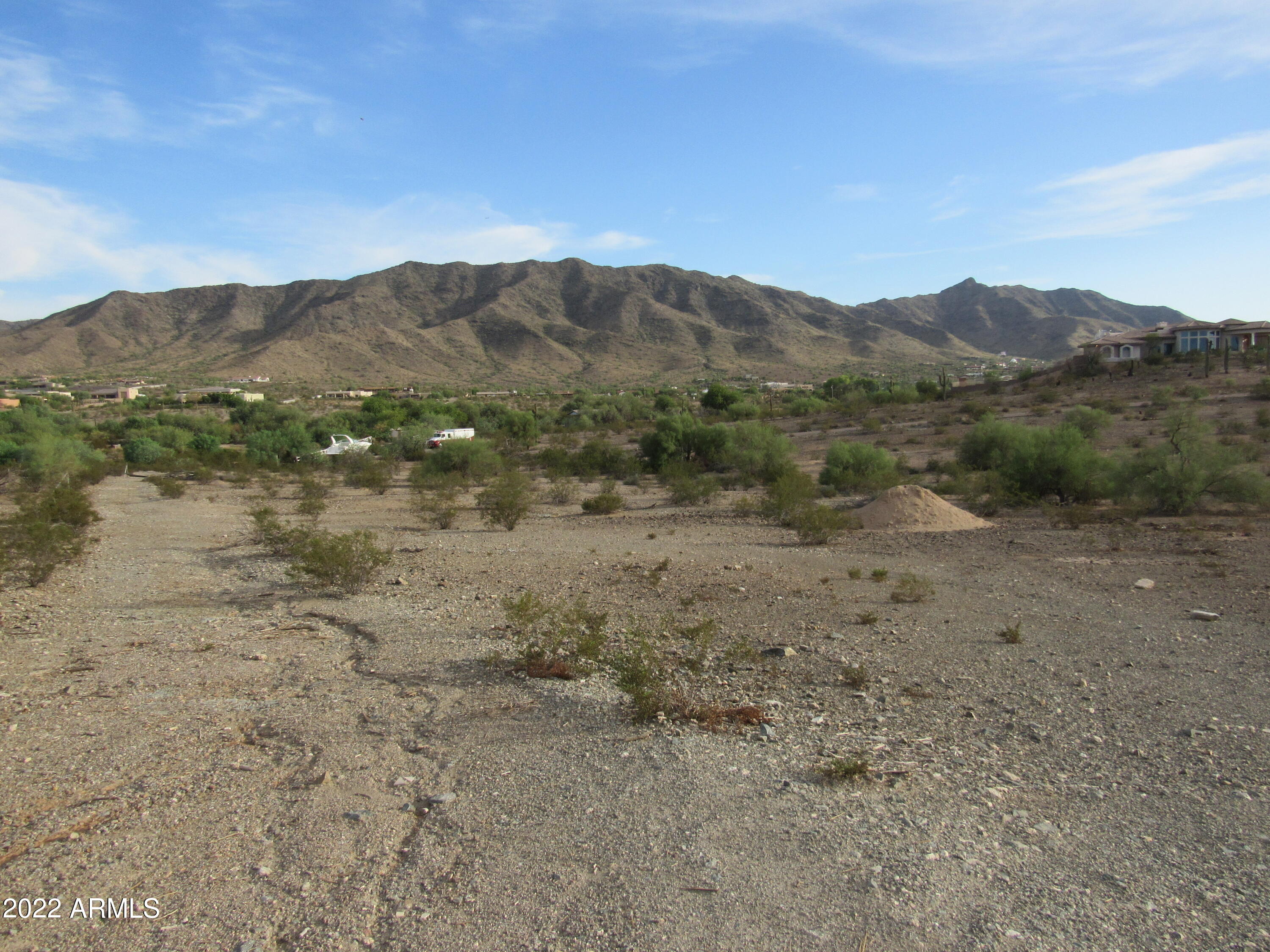 2211 West Dobbins Road, Unit A Phoenix, AZ 85041 - Photo 20 of 33 a view of a lake with mountains in the background