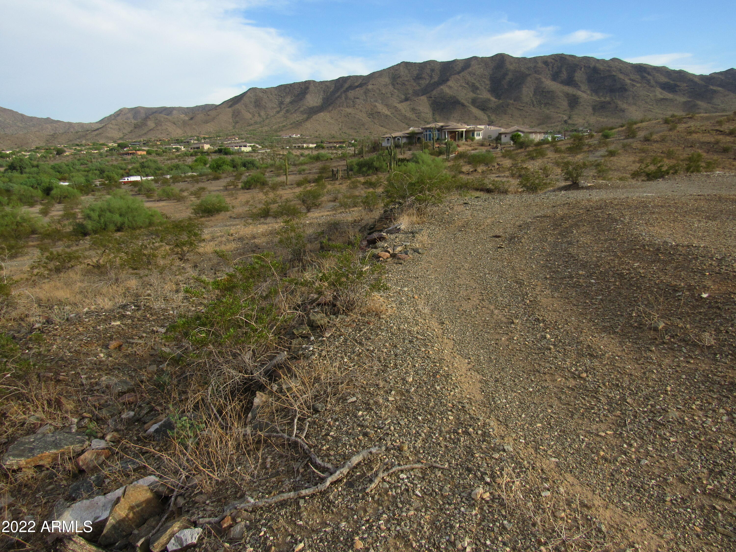 2211 West Dobbins Road, Unit A Phoenix, AZ 85041 - Photo 28 of 33 a view of a mountain in the distance in a field