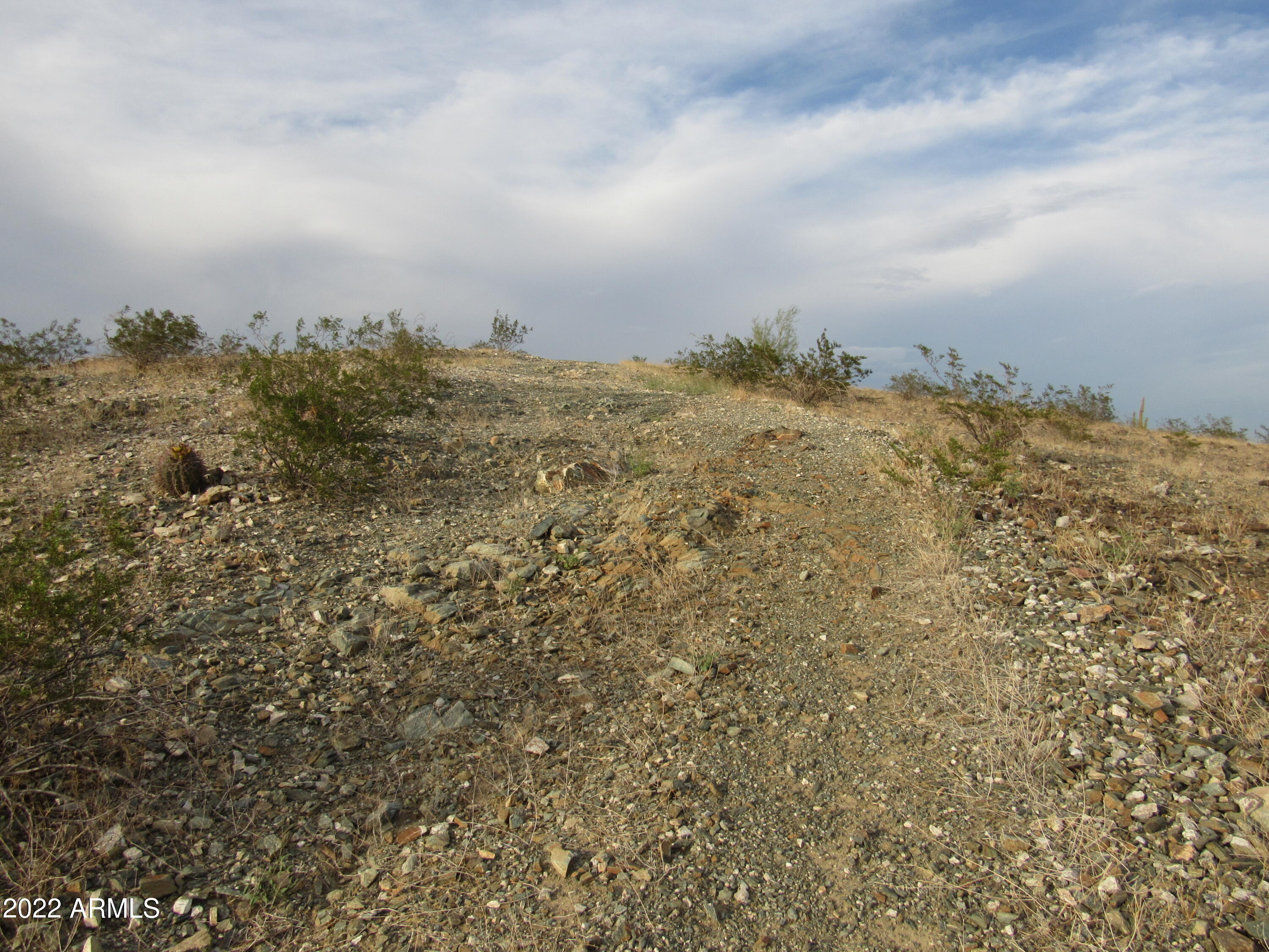 2211 West Dobbins Road, Unit A Phoenix, AZ 85041 - Photo 29 of 33 a view of a large building with mountains in the background