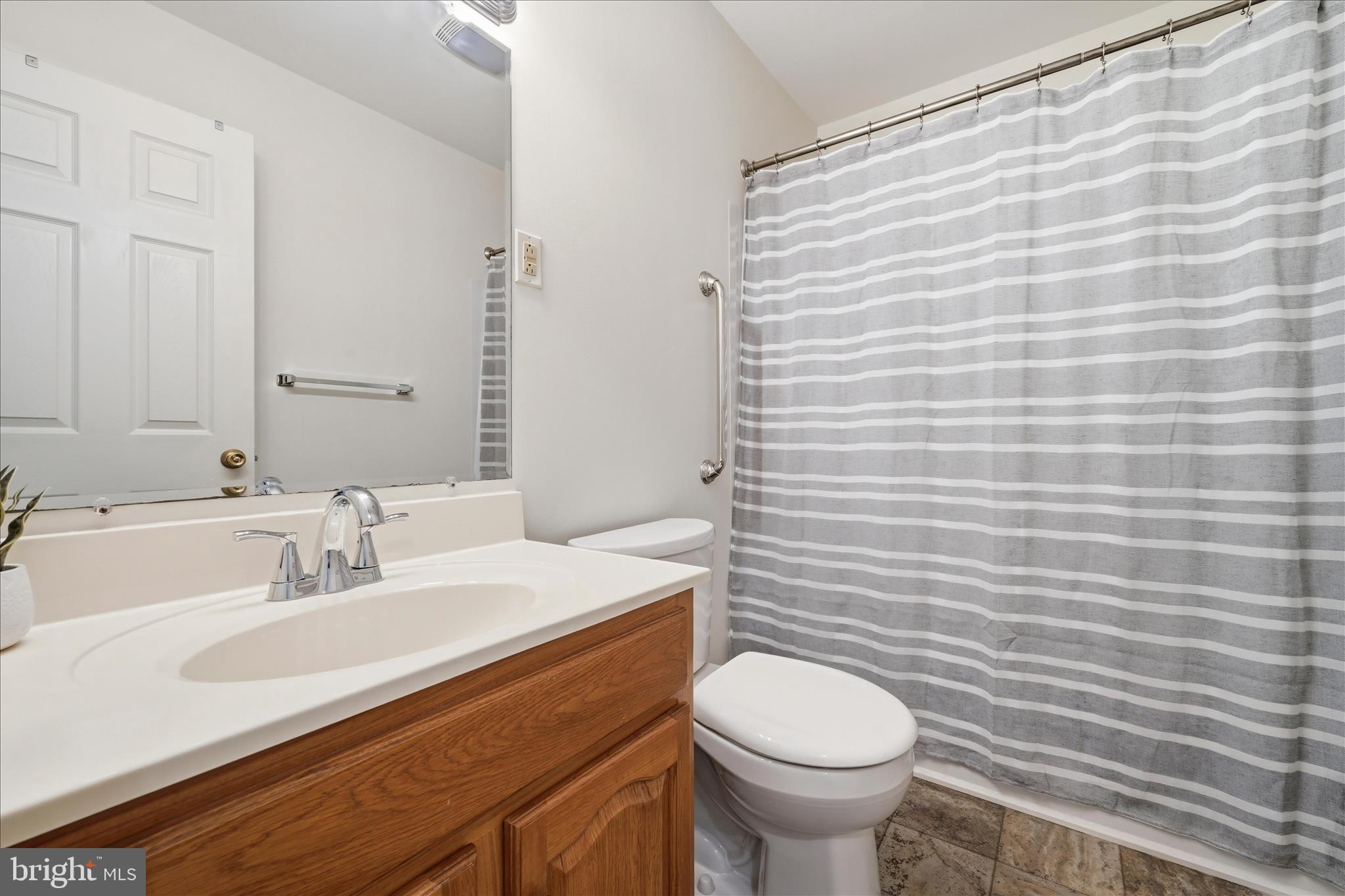 1988 Chestnut Hill Road Mohnton, PA 19540 - Photo 24 of 33 a bathroom with a sink toilet and mirror