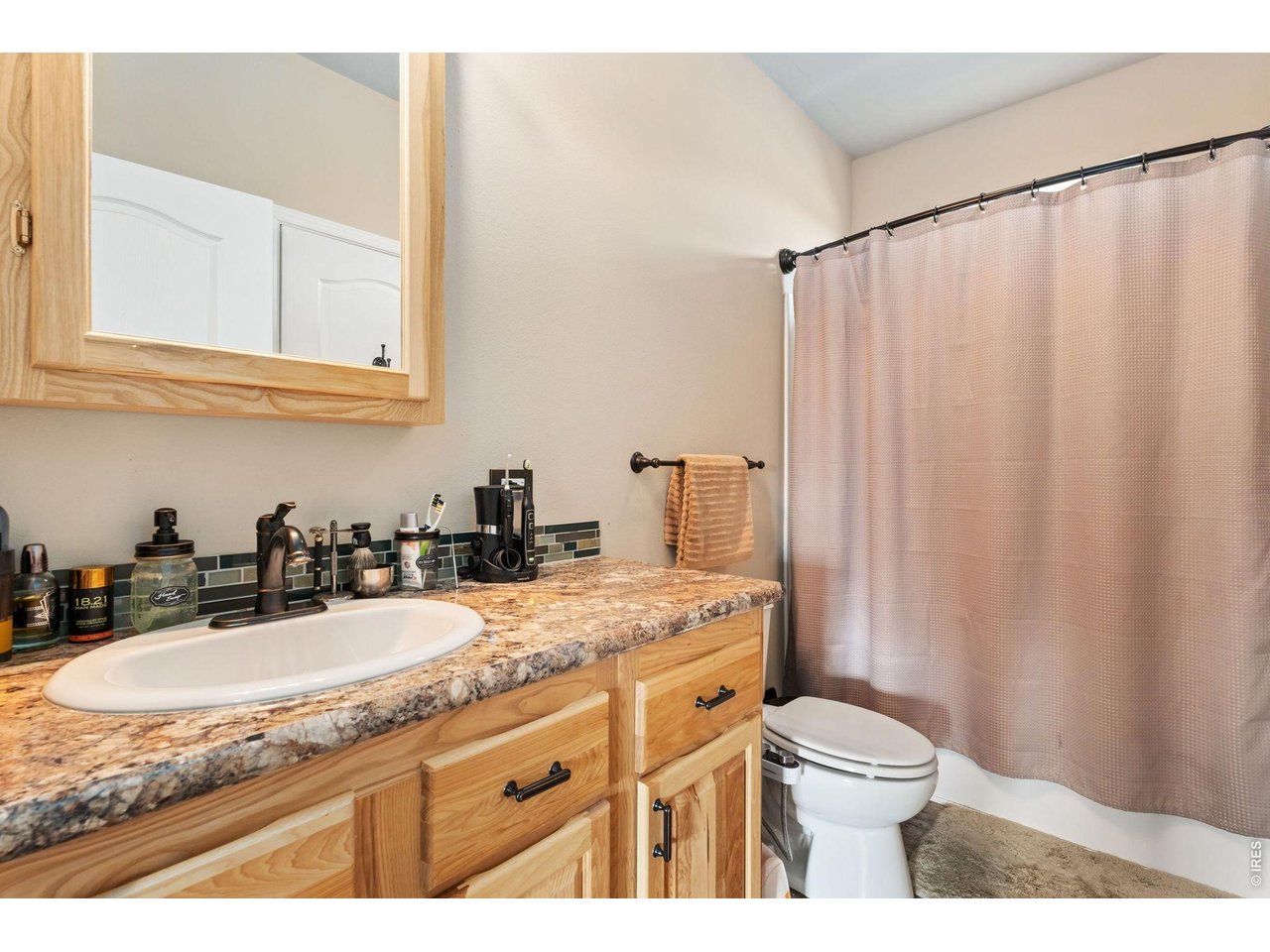 62 Rabbit Ears Court Livermore, CO 80536 - Photo 15 of 36 a bathroom with a granite countertop sink toilet and mirror