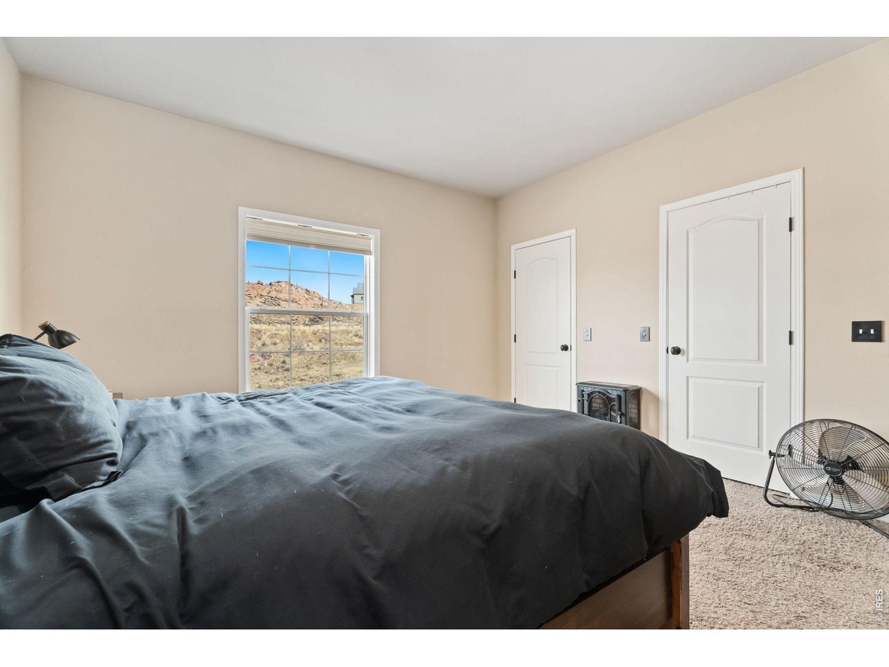 62 Rabbit Ears Court Livermore, CO 80536 - Photo 23 of 36 a bedroom with a bed and a dresser