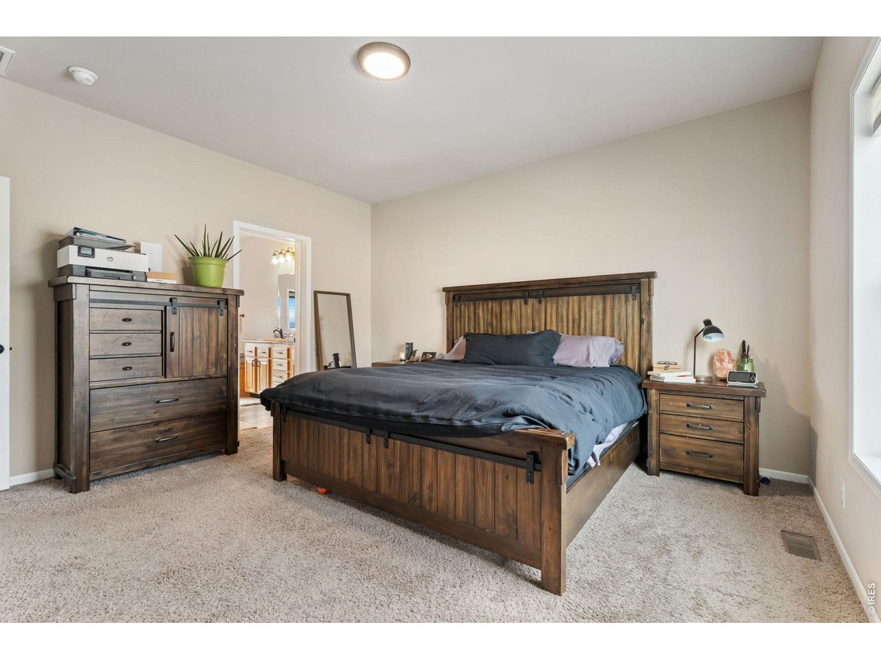 62 Rabbit Ears Court Livermore, CO 80536 - Photo 24 of 36 a bedroom with a bed and furniture