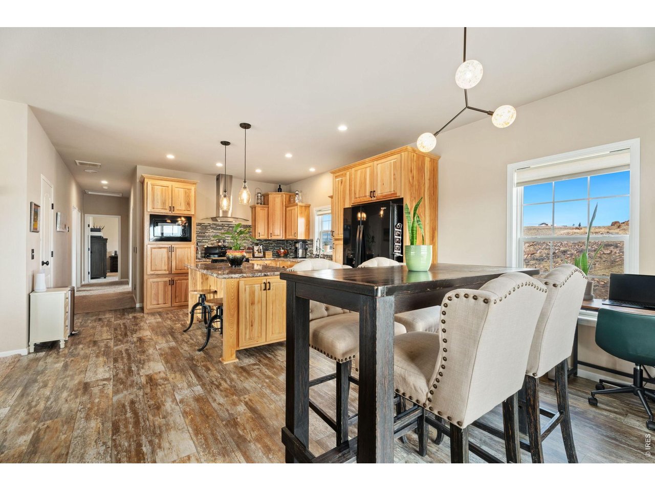 62 Rabbit Ears Court Livermore, CO 80536 - Photo 5 of 36 a living room with stainless steel appliances kitchen island granite countertop furniture and a kitchen view