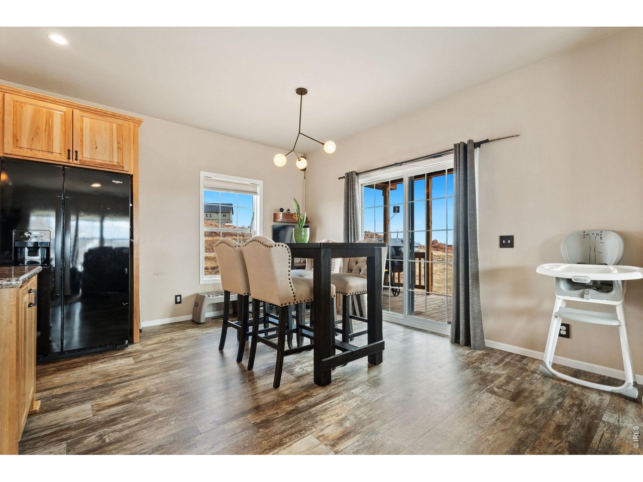 62 Rabbit Ears Court Livermore, CO 80536 - Photo 6 of 36 a view of a dining room with furniture window and wooden floor