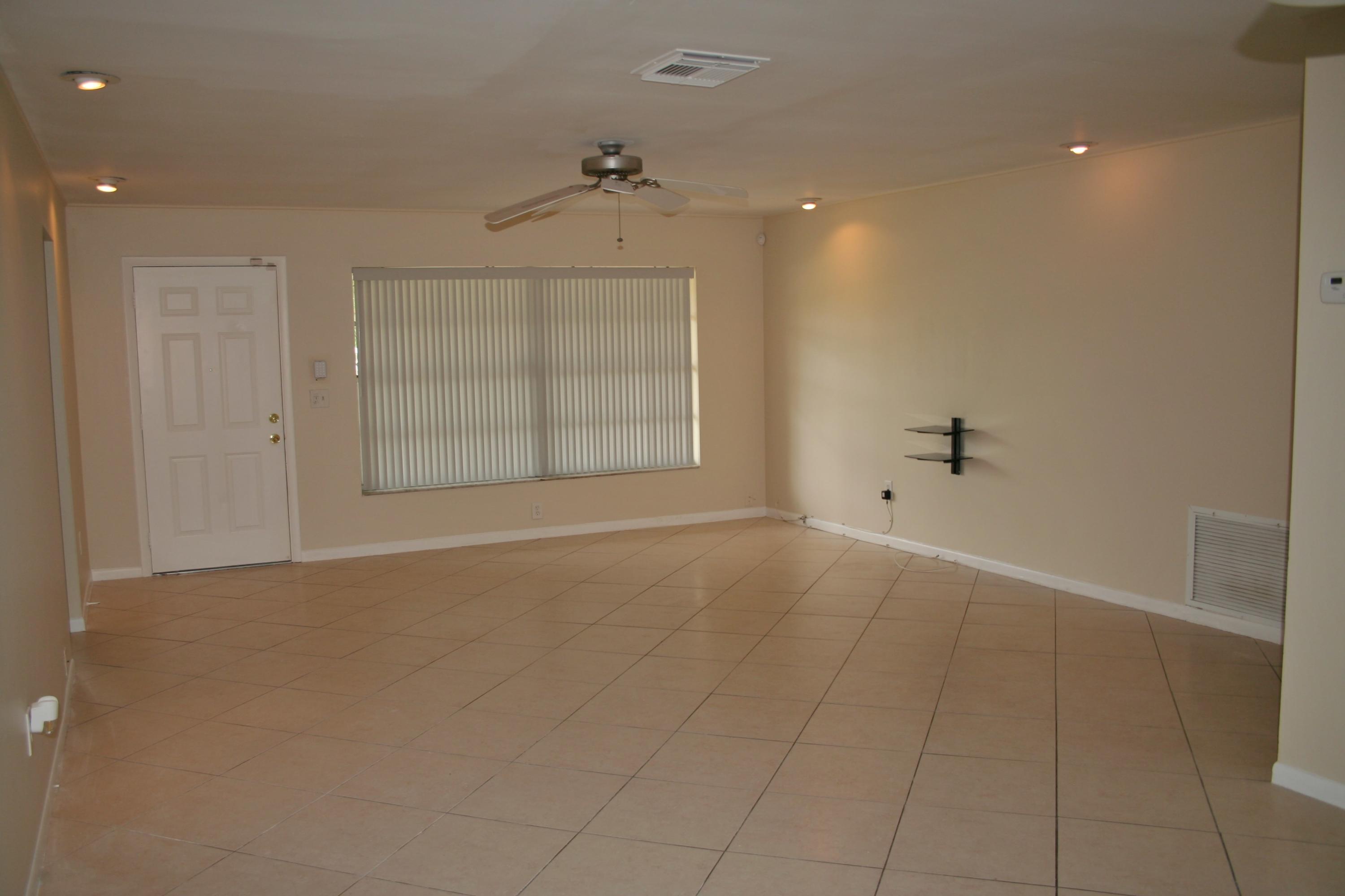 22676 Southwest 65th Terrace Boca Raton, FL 33428 - Photo 3 of 12 an empty room with windows and closet