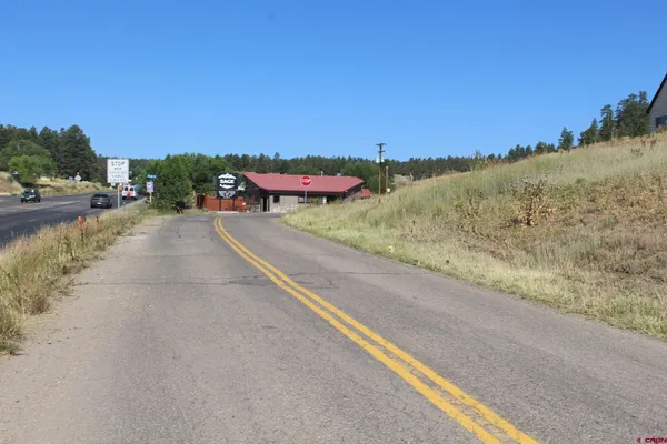 a view of a road with a yard
