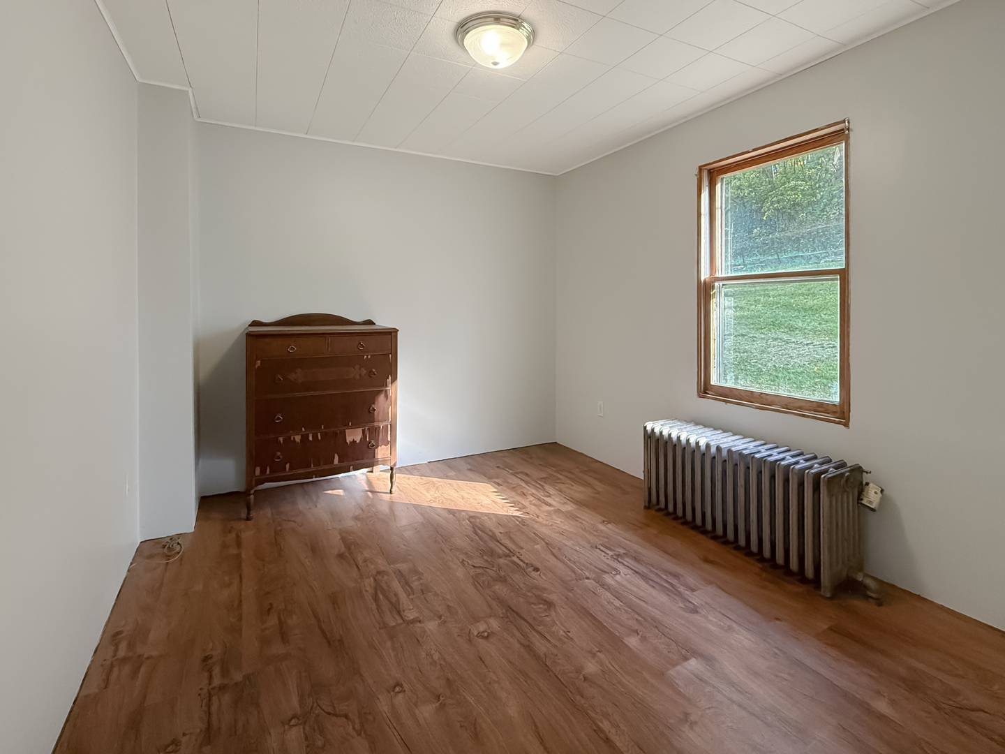 372 North 2629th Road Oglesby, IL 61348 - Photo 17 of 22 an empty room with wooden floor and windows