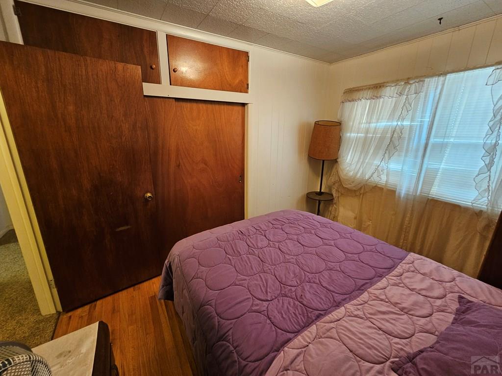 900 Rittgers Street Eads, CO 81036 - Photo 12 of 35 a bedroom with a bed and a mirror