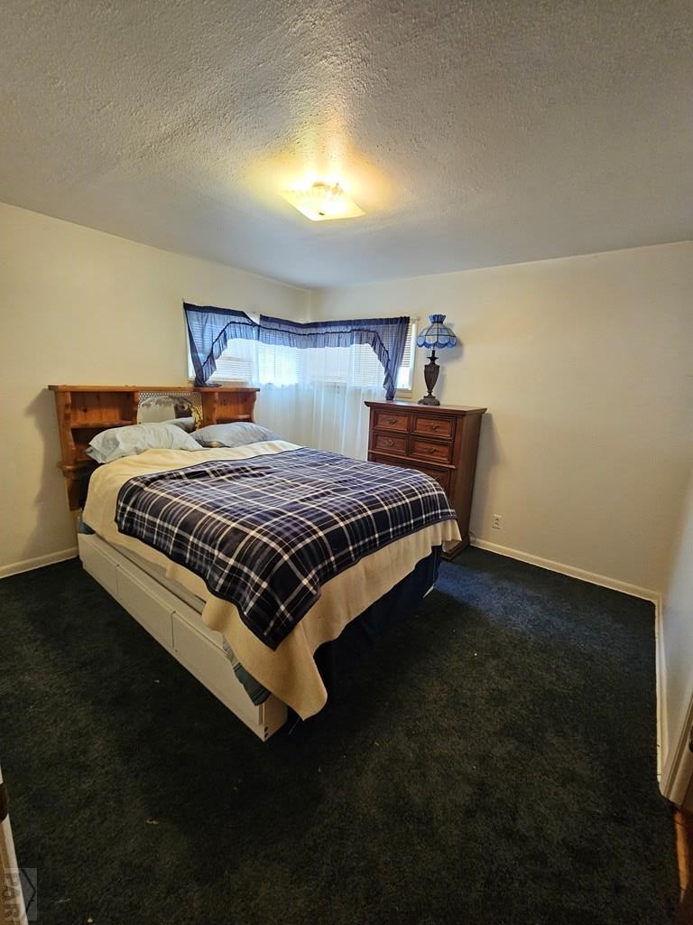 900 Rittgers Street Eads, CO 81036 - Photo 16 of 35 a bedroom with a bed and window